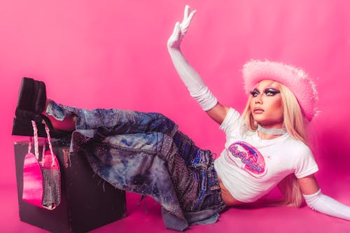 Free Woman in Glamour Makeup Wearing a Pink Fluffy Hat Stock Photo