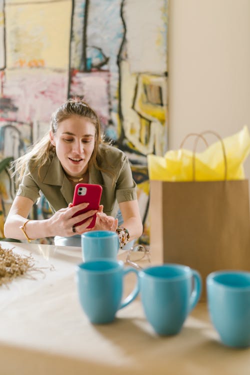 Free A Woman Taking Photo of a Mug Stock Photo